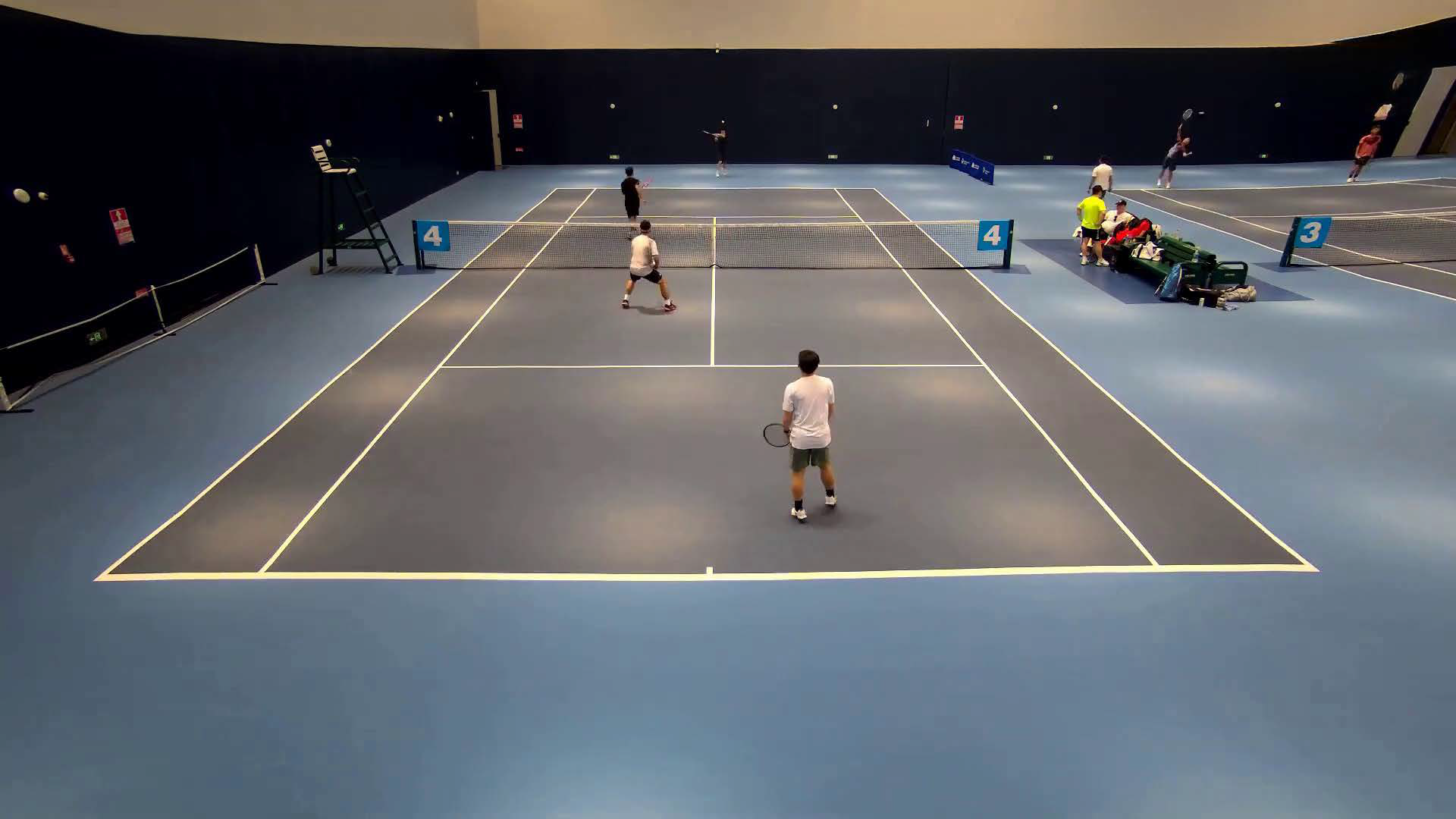 Visible balls in play on two courts